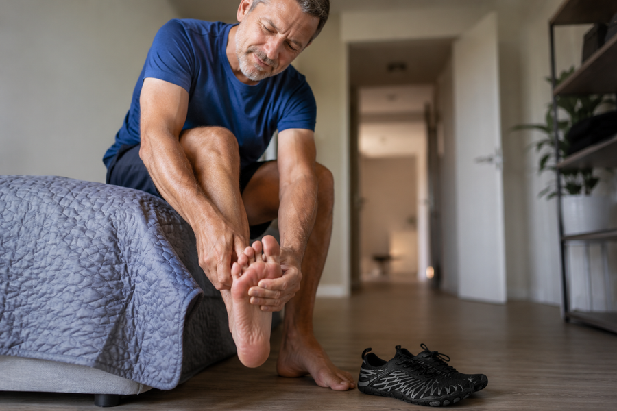 Foot specialist holding the Selorna copper grounding barefoot shoe