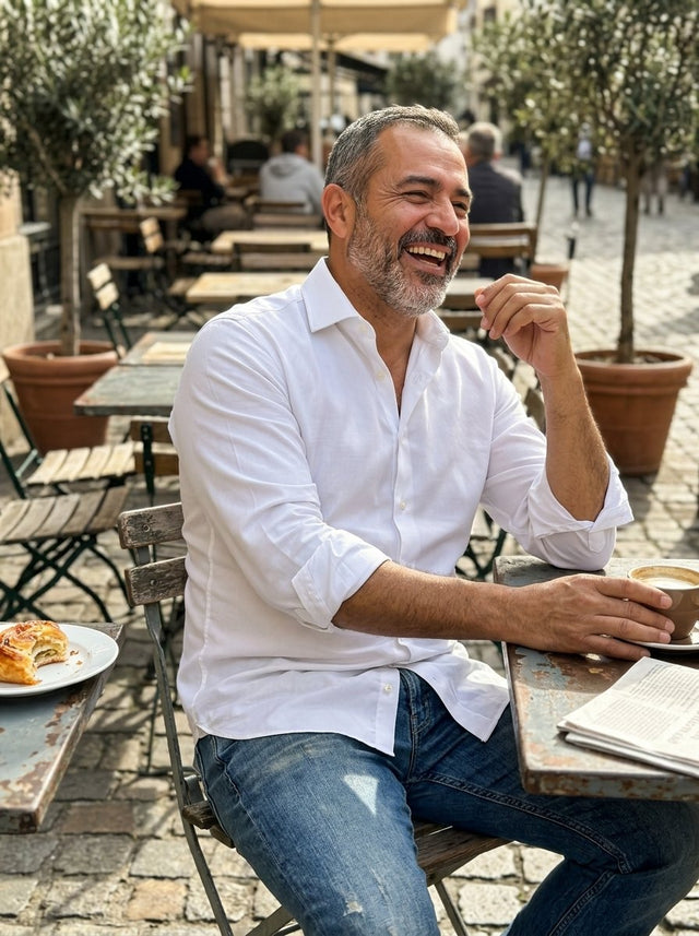A man at a weekend café in the white shirt with jeans
